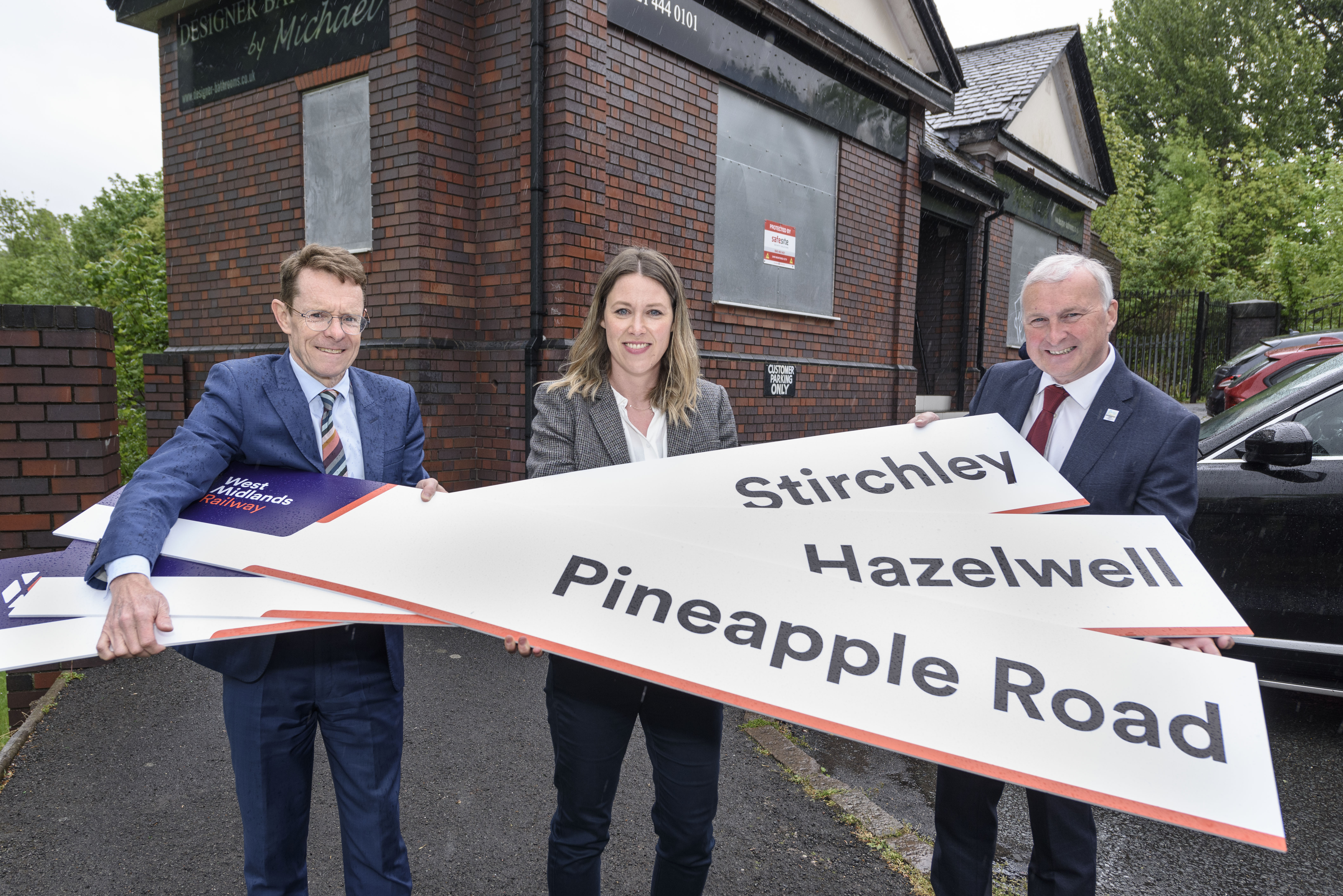 Mayor Andy Street, Kate Trevorrow (WMRE) and Councillor Ian Ward outside the original Hazelwell station building