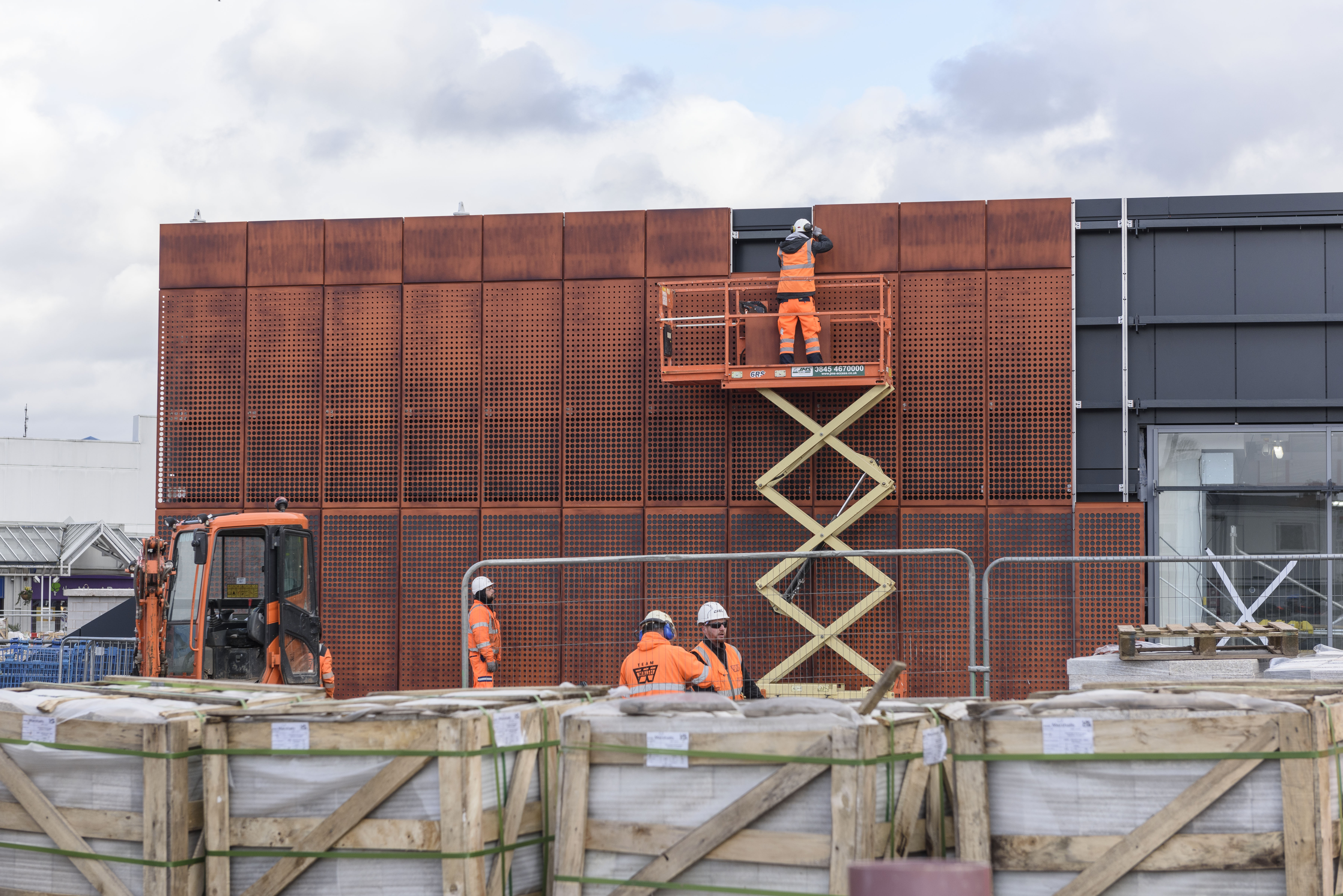Cladding being installed at Perry Barr station