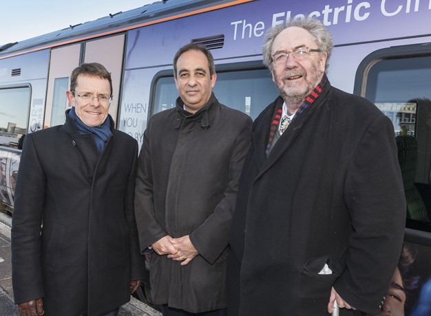 Executives in front of a train